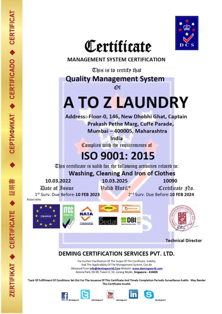 Official DCS Quality Management System Certificate issued under ISO 9001:2015 to A TO Z LAUNDRY in Cuffe Parade, Mumbai, complete with accreditation partner logos, certificate number 10090, and a technical director signature stamp.
