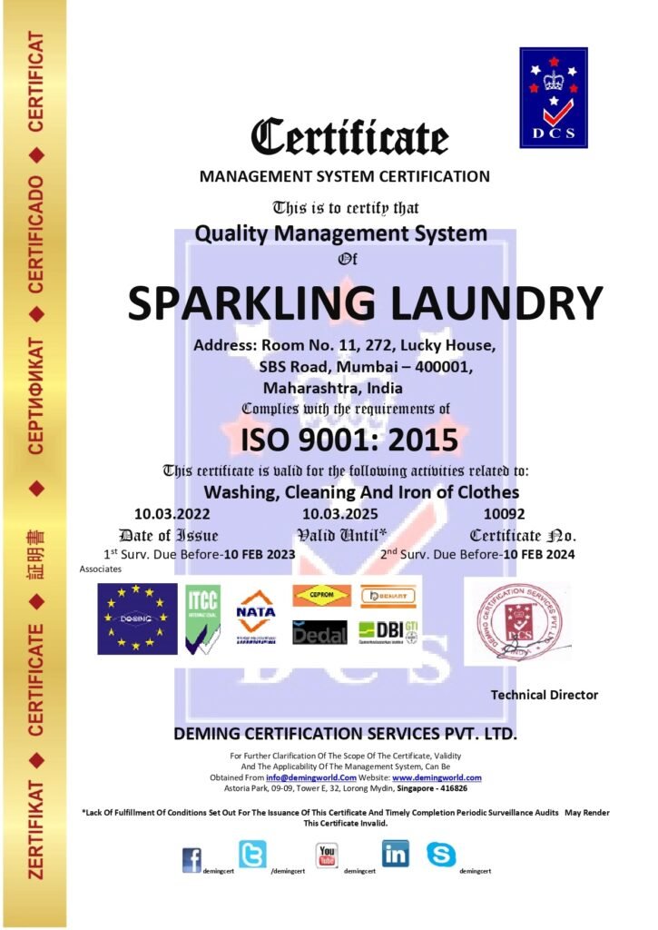 Official DCS Quality Management System Certificate issued under ISO 9001:2015 to SPARKLING LAUNDRY in SBS Road, Mumbai, complete with accreditation partner logos, certificate number 10092, and a technical director signature stamp.